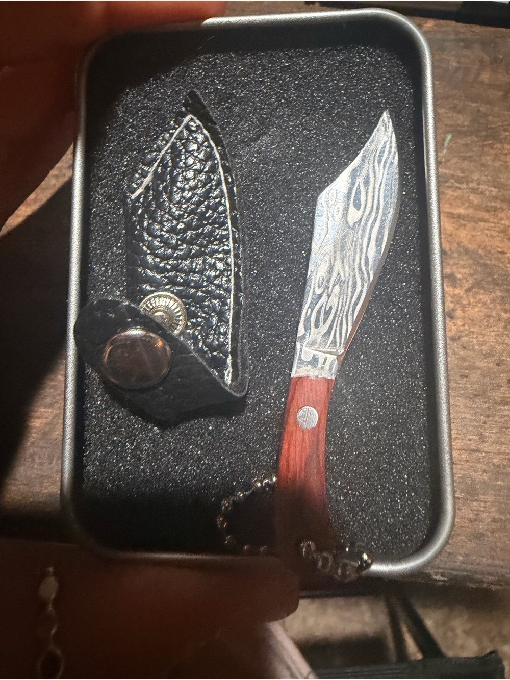 Damascus Pattern Pocket Knife with Brown Wood Handle and Black Sheath
